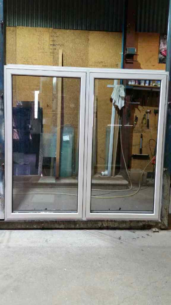 Twin Awning alum window in Merino powdercoat.
